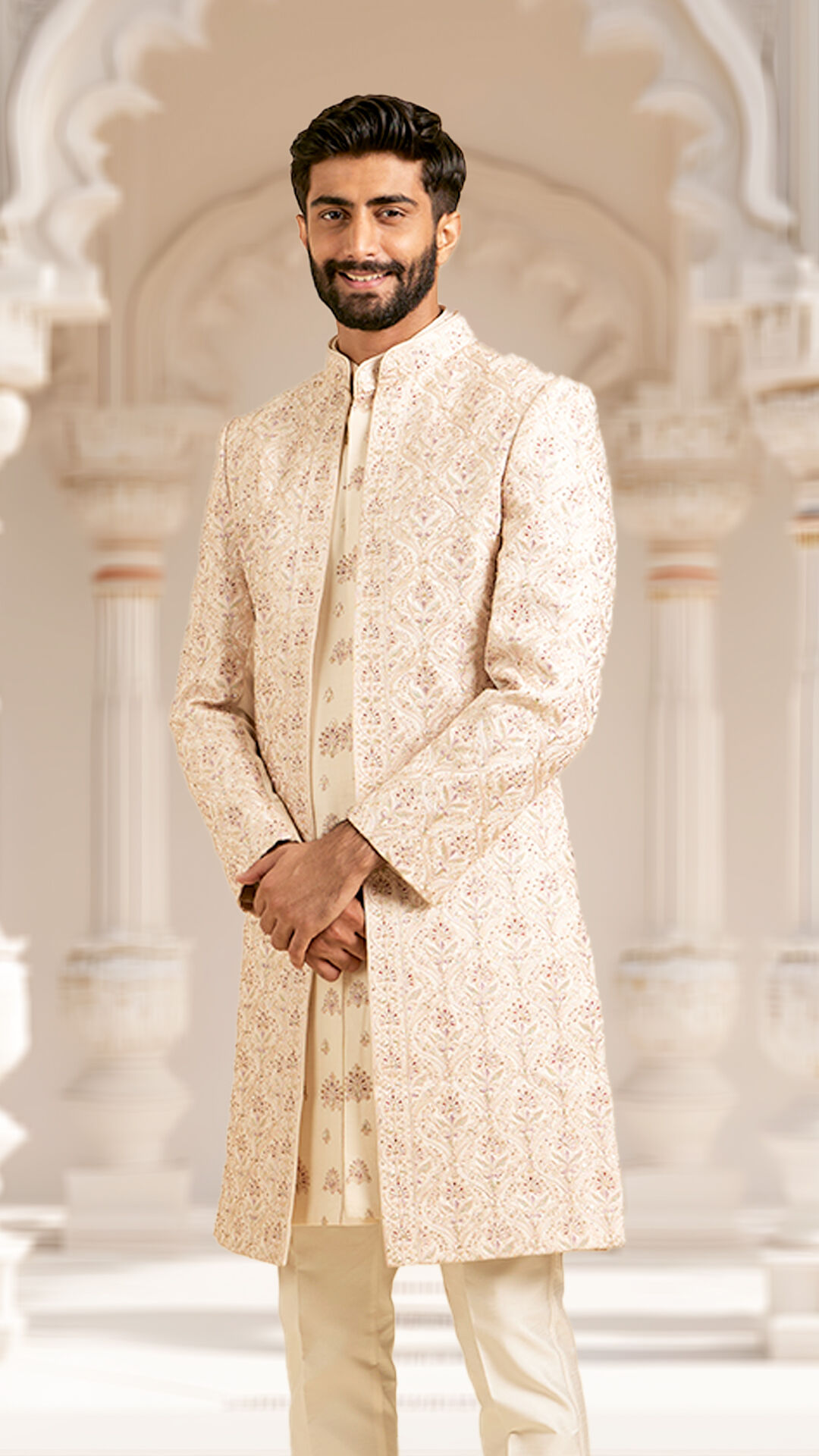 A groom in embellished pink sherwani on wedding